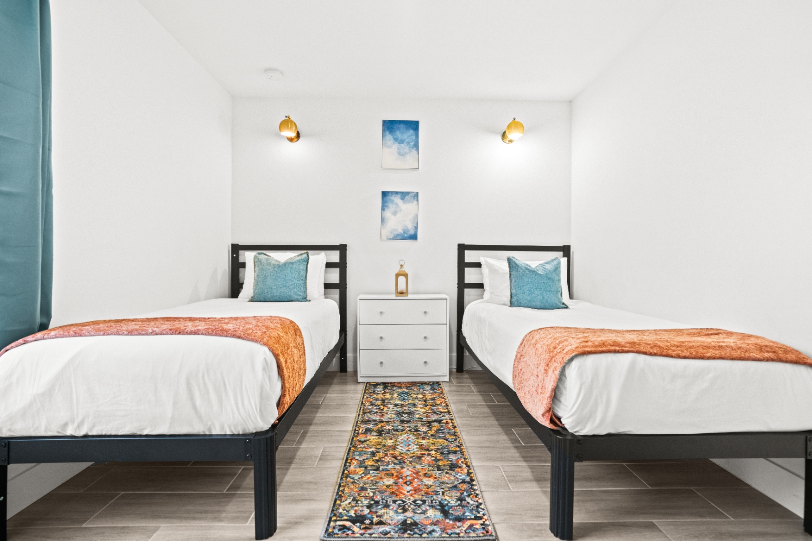 Third bedroom with two twin beds and sky prints
