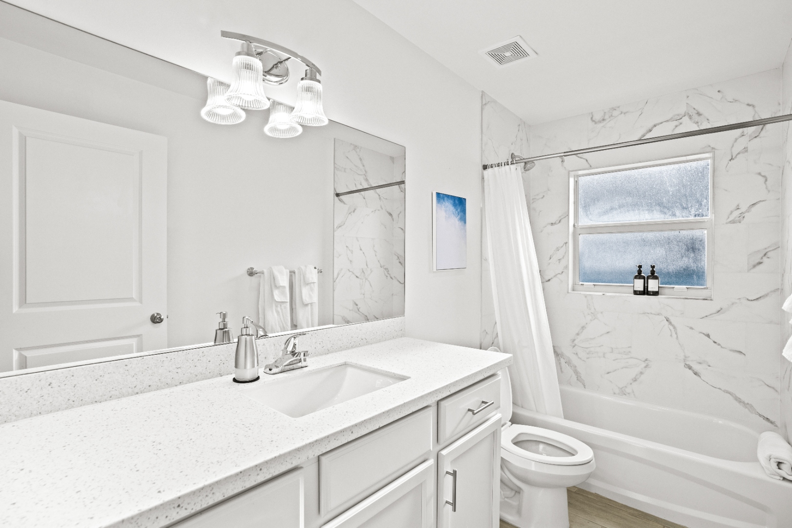 Second bathroom with marble tile shower